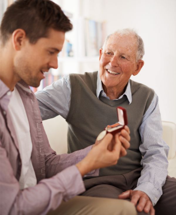 Grandfather showing grandson heirloom medal